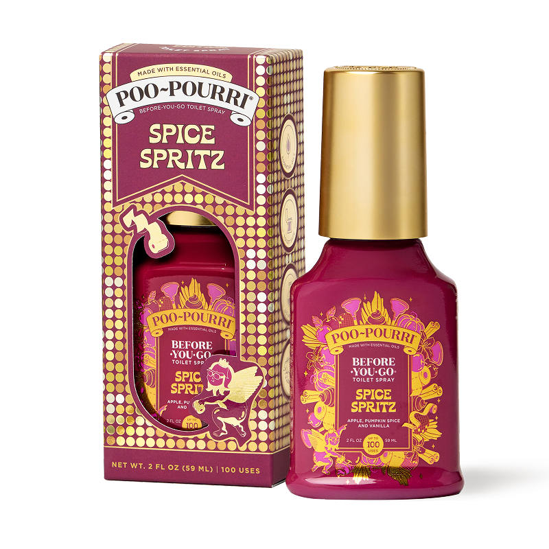 A ~Poo-Pourri “Before You Go” toilet spray in the Spice Spritz scent is displayed alongside its packaging against a white background. The bottle features an ornate label with cherubs, toilet paper, and fall elements. The packaging highlights key product benefits, including its ability to trap odors, the use of essential oils, and the absence of aerosols. The scent is described as a blend of apple, pumpkin spice, and vanilla. The bottle contains 2 fl oz (59 ml) for up to 100 uses.