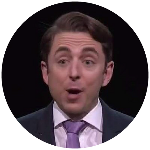 A brown-haired individual, donning a sharp suit and purple tie, appears astonished by the unfolding events.