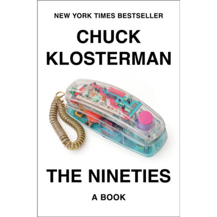 The book cover for The Nineties by Chuck Klosterman showcases a striking clear rotary phone with exposed circuits, reminiscent of vintage technology.