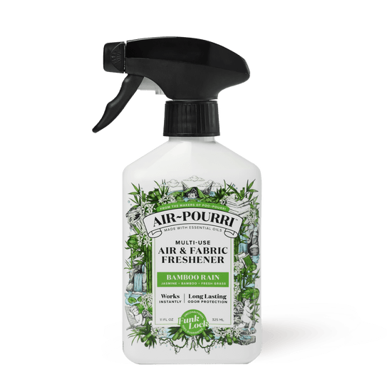 The Bamboo Rain - Home~Pourri Room Spray by ~Pourri, featuring black and green illustrations, is infused with essential oils to freshen up spaces with a bamboo scent and tackle home odors.
