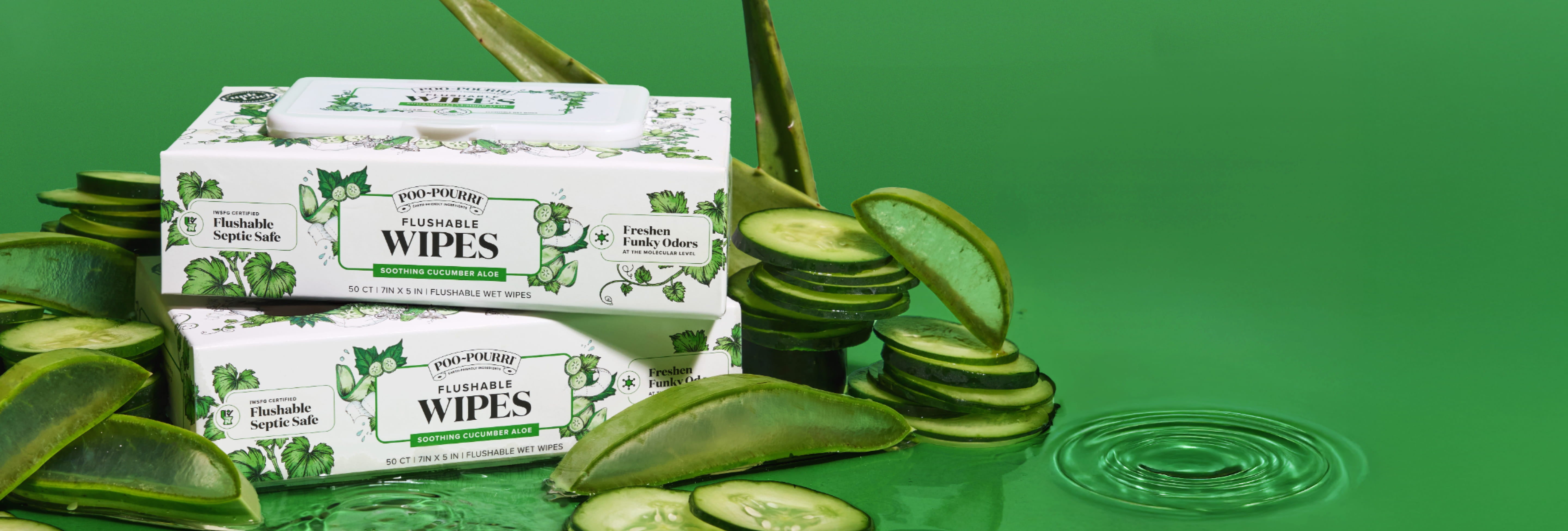 Two boxes of 'Flushable Wipes' with aloe and cucumbers on a green background