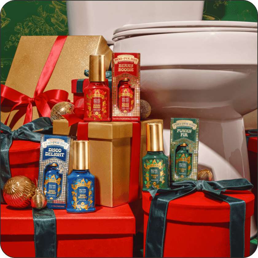 Three bottles of Poo~Pourri holiday-themed scents with gold caps on a decorative background with ribbons and gift boxes.