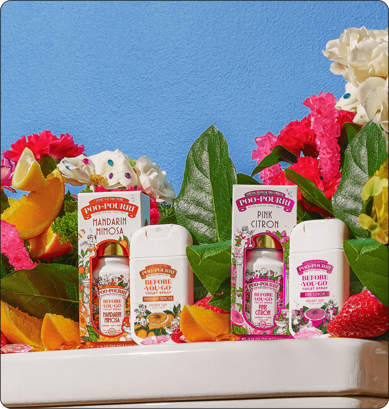 Bottle of Poo~Pourri Mandarin Mimosa and Pink Citron on top of a toilet amidst flowers and leaves.