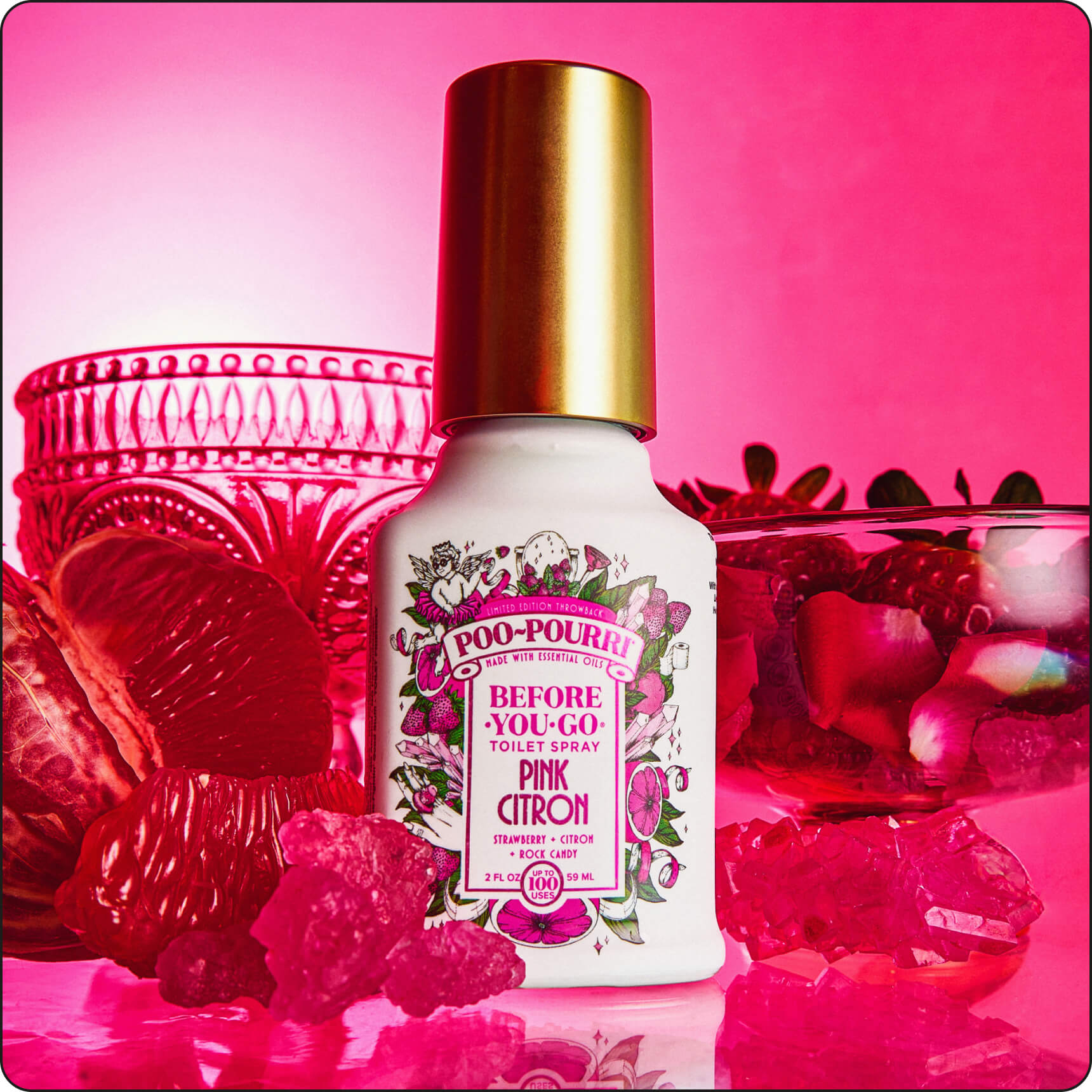 Poo-Pourri Pink Citron bottle with pink background and decorative elements such as rock candy and strawberries.